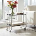 2-Tier FoldingKitchen Cart on Wheels – Chromed Frame and black shelves holding books and decorative items in a dining room