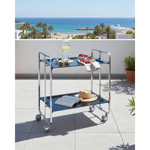 2-Tier Folding serving Cart on Wheels with chrome frame and black shelves, book, drink and fruit on a beachside terrace