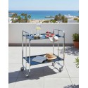 2-Tier Folding serving Cart on Wheels with chrome frame and black shelves, book, drink and fruit on a beachside terrace