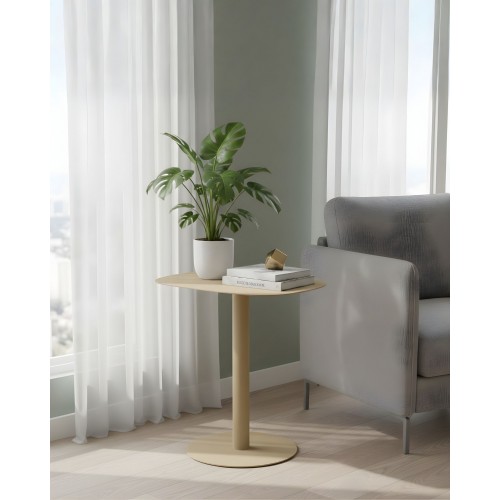 SKANDY sand side table beside armchair with books