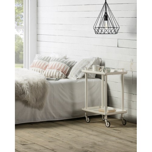 LEKY Bar & Serving Cart as nightstand with books and mug beside bed