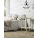 LEKY Bar & Serving Cart as nightstand with books and mug beside bed